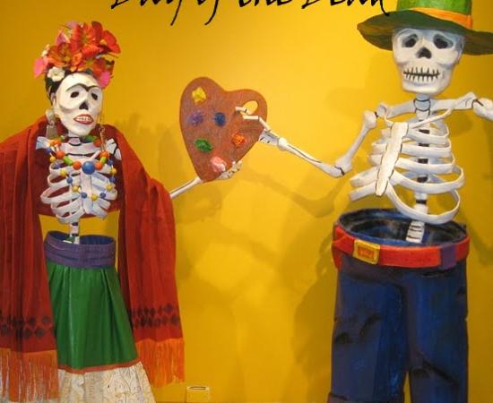 Two skeletons dressed up against a yellow wall. There is text on the wall that says All You Need to Know to Teach Dia de los Muertos, Day of the Dead